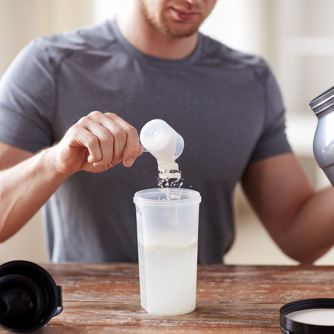 Close up of Man with Protein Shake Bottle and Jar