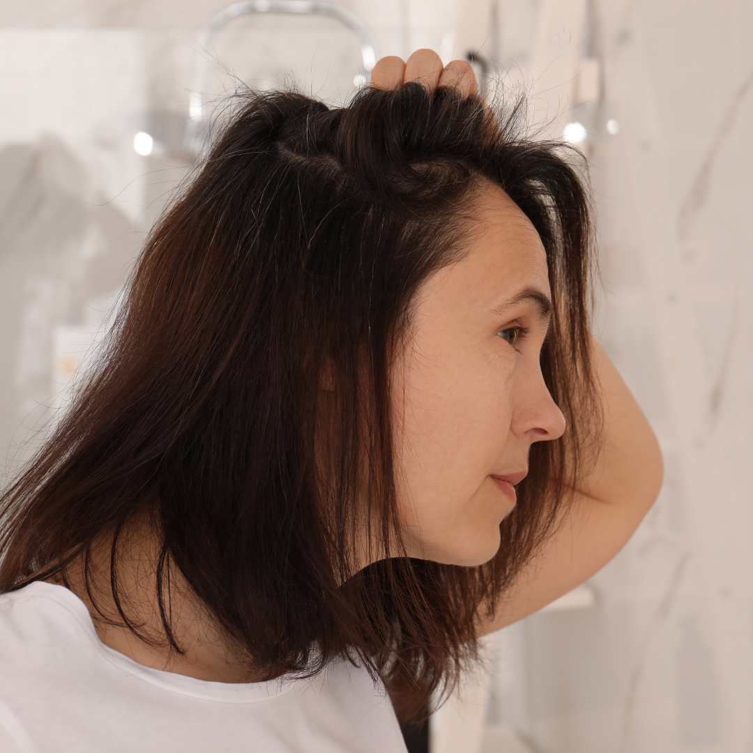 woman checking her hair