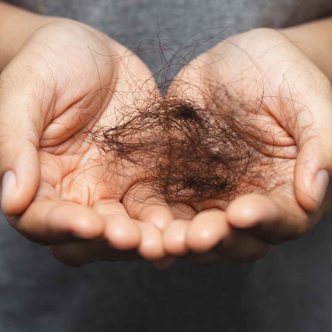 holding falling hair