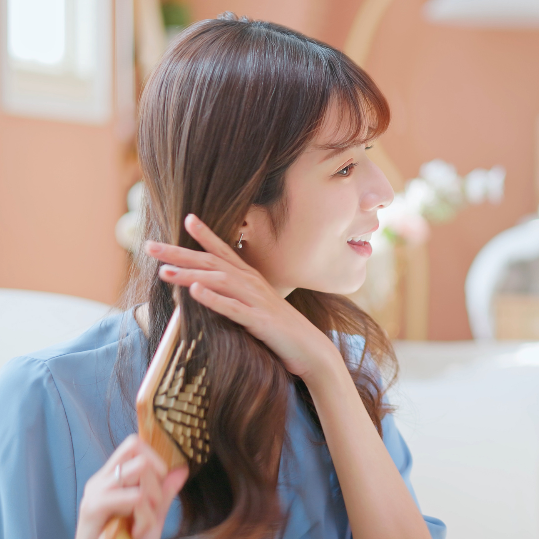 asian girl combing good hair