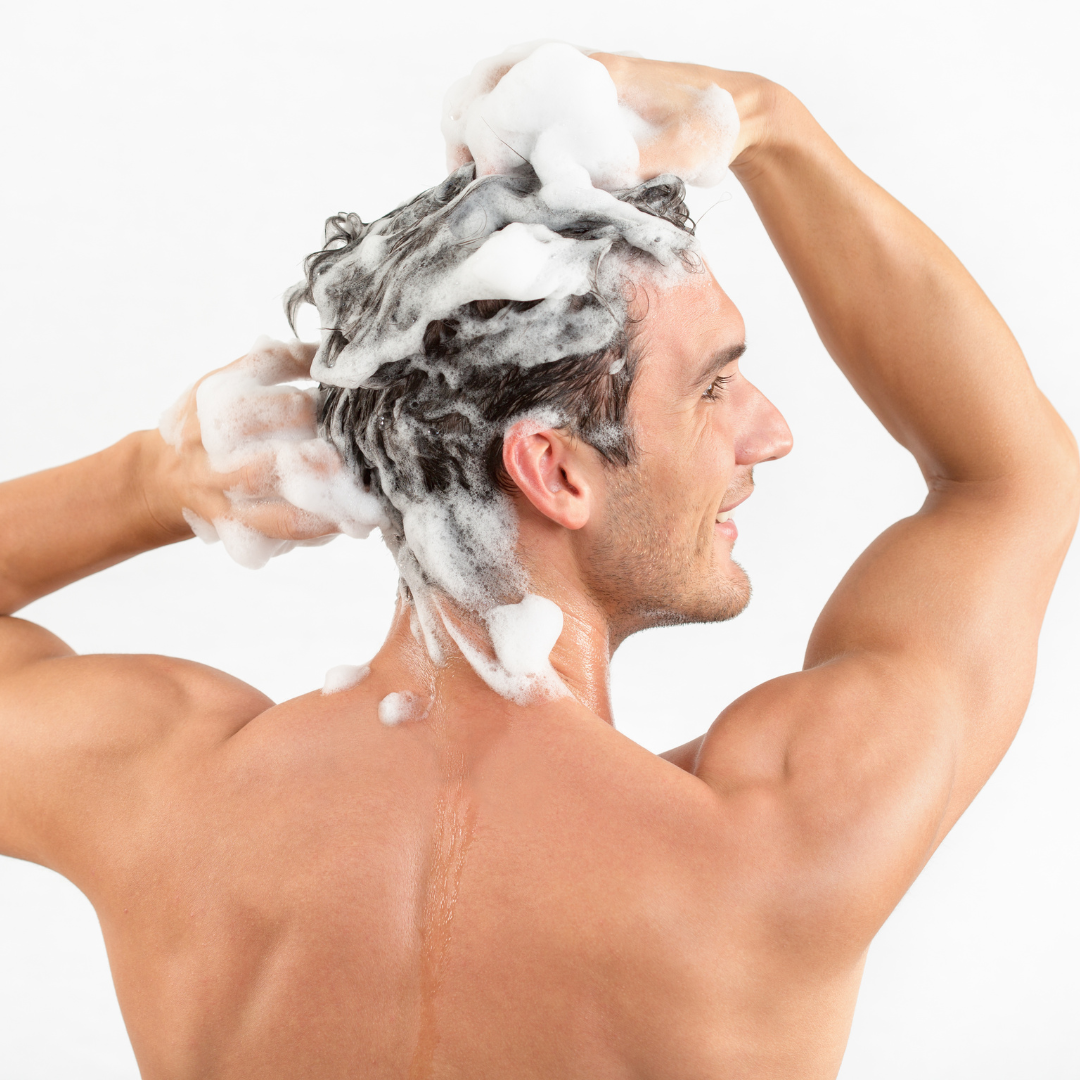 man washing hair with shampoo