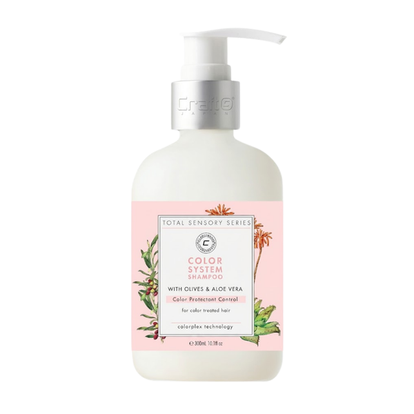 Shampoo bottle with pink label featuring green leaves on a white background