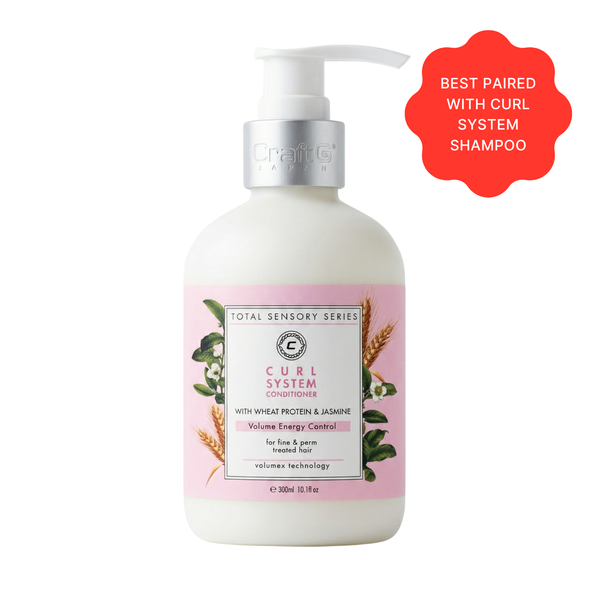 White bottle of 'Total Sensory Series' Curl System Conditioner with pink label on a white background