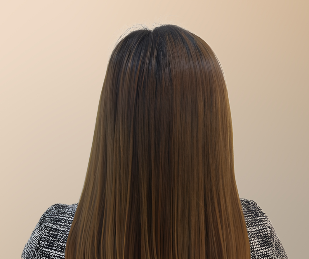 Person with long, straight brown hair against a beige background