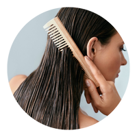 a woman combing her hair