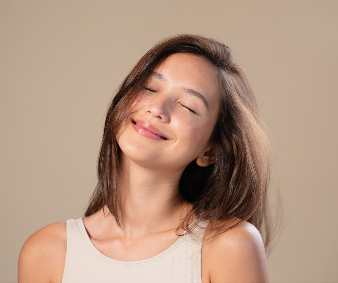 a woman smiling while looking up