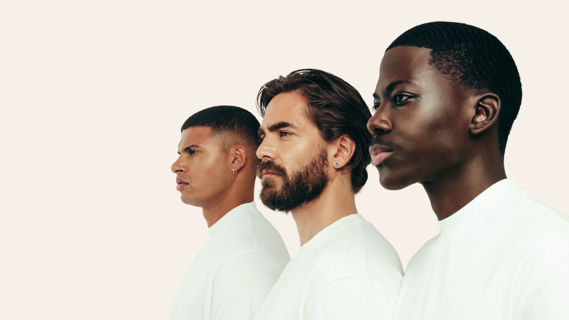 three men looking to the left