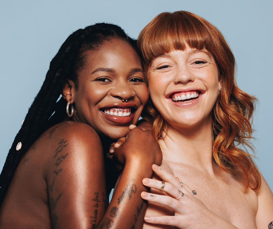 two women smiling at the camera